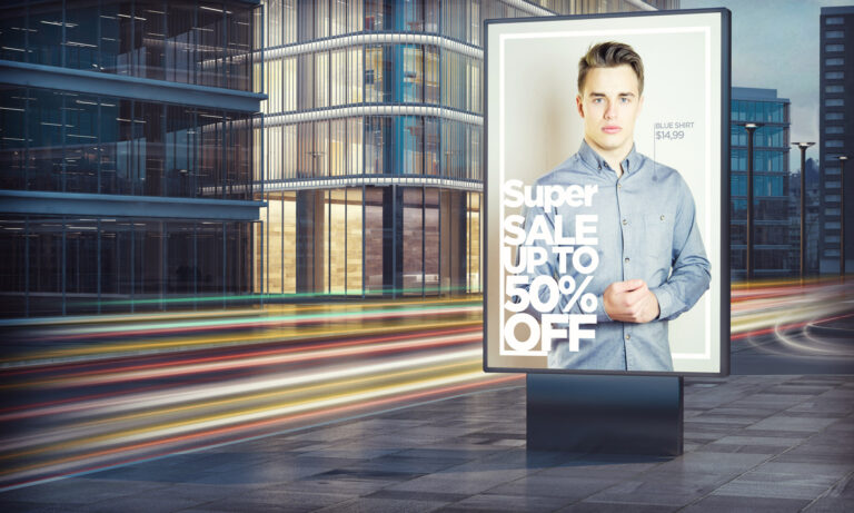 Advertising fashion sale billboard in city night