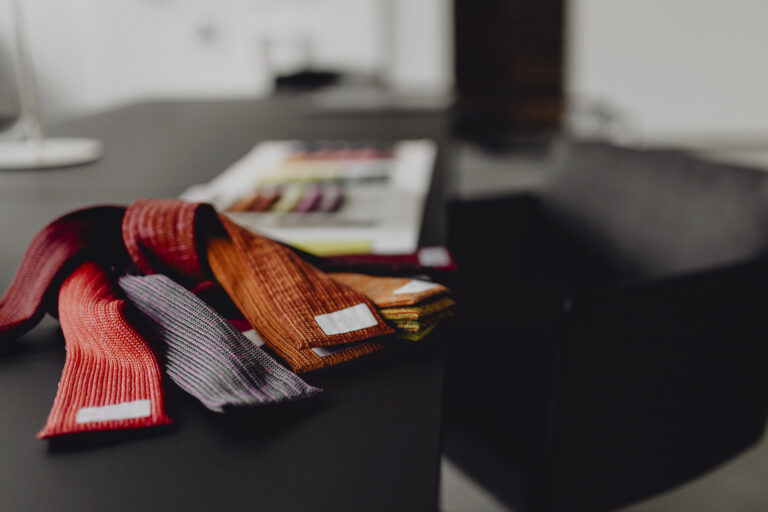 Closeup of textile samples on a black table